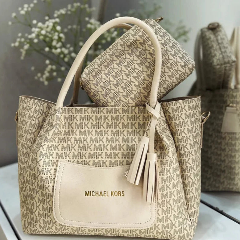 Collection of Michael Kors handbags with a neutral background
