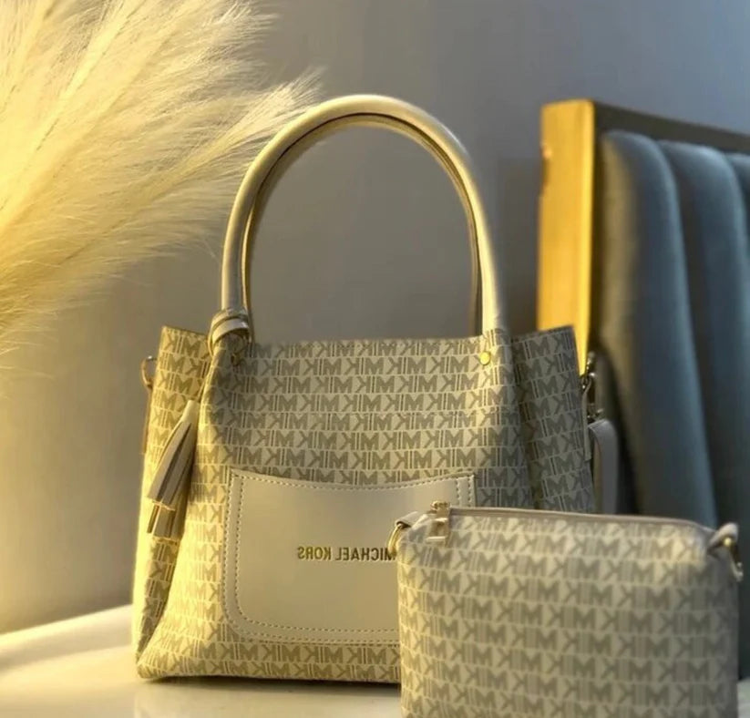 Collection of Michael Kors handbags with a neutral background