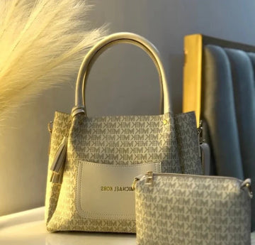 Collection of Michael Kors handbags with a neutral background