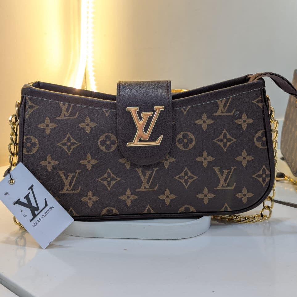 Louis Vuitton handbag with monogram pattern on a white surface