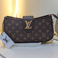 Louis Vuitton handbag with monogram pattern on a white surface